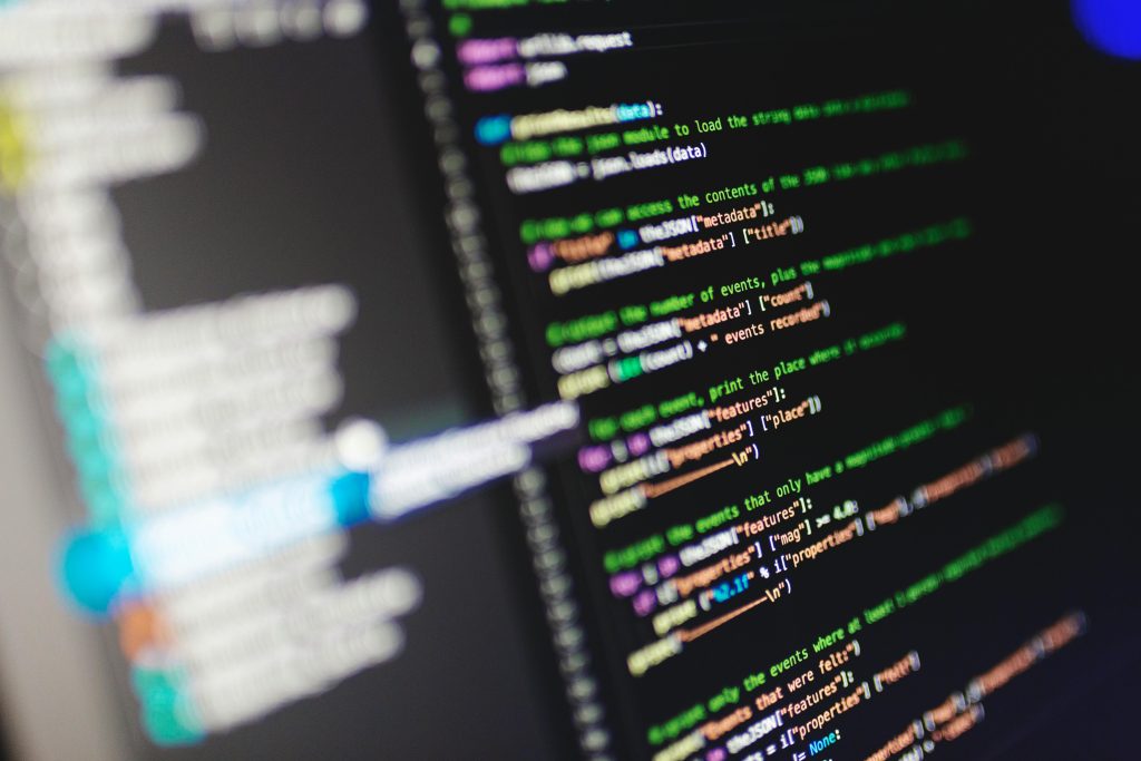 Home Close-up of a computer screen displaying colorful programming code in JavaScript.